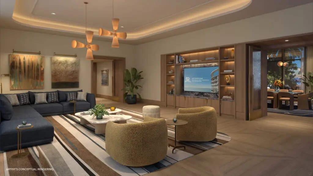 St. Regis Bahia Mar residents library lounge with bookshelves, armchairs and a media screen