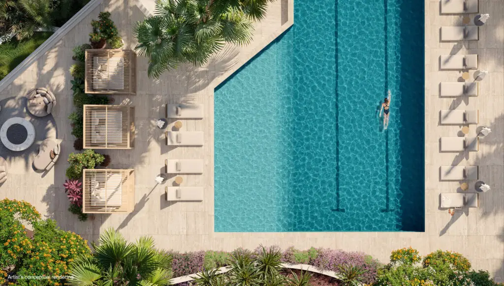 Overhead view of the St. Regis Bahia Mar lap pool with poolside loungers and landscaping