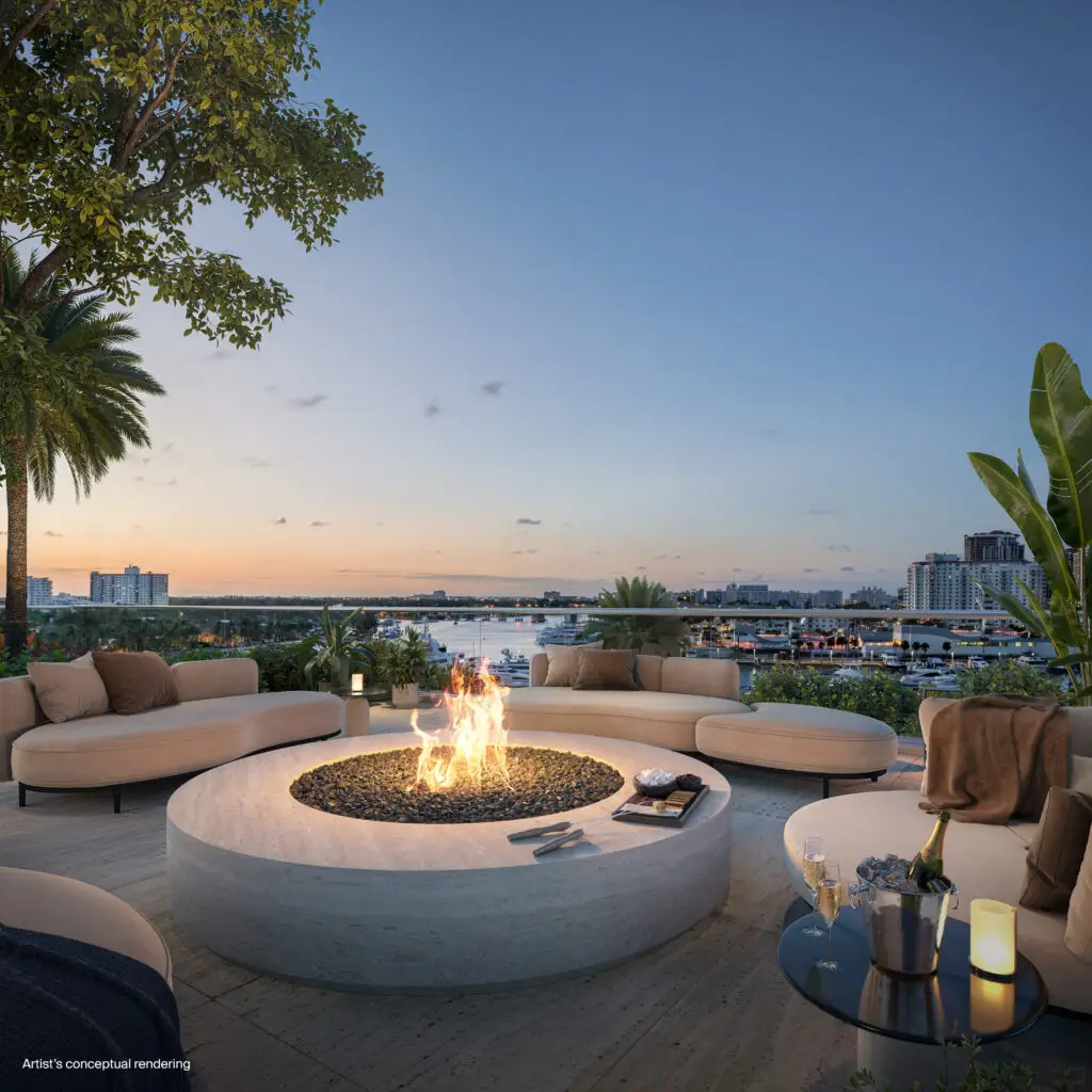 St. Regis Bahia Mar outdoor fire pit with curved lounge seating overlooking the marina at sunset